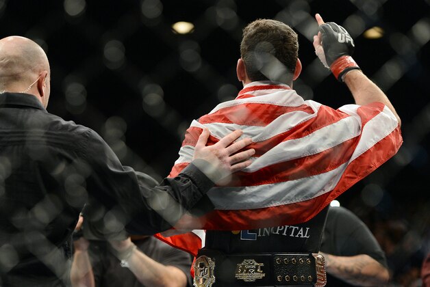 Dec 28, 2013; Las Vegas, NV, USA;    Chris Weidman reacts in the cage after defeating Anderson Silva (not pictured) in their UFC middleweight championship bout at the MGM Grand Garden Arena. Mandatory Credit: Jayne Kamin-Oncea-USA TODAY Sports