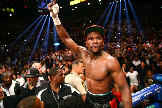 May 3, 2014; Las Vegas, NV, USA; Floyd Mayweather Jr. celebrates after defeating Marcos Maidana (not pictured) during their fight at the MGM Grand. Mandatory Credit: Mark J. Rebilas-USA TODAY Sports