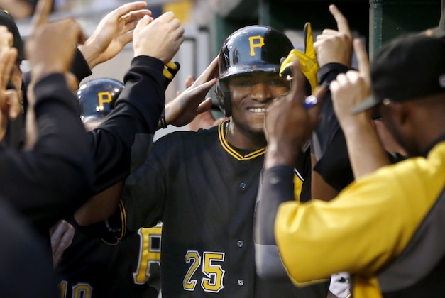 Pittsburgh Pirates' Gregory Polanco (25) is greeted by teammates in the dugout after hitting a three-run home run against the New York Mets in the fifth inning of a baseball game  Thursday, June 26, 2014, in Pittsburgh. (AP Photo/Keith Srakocic)