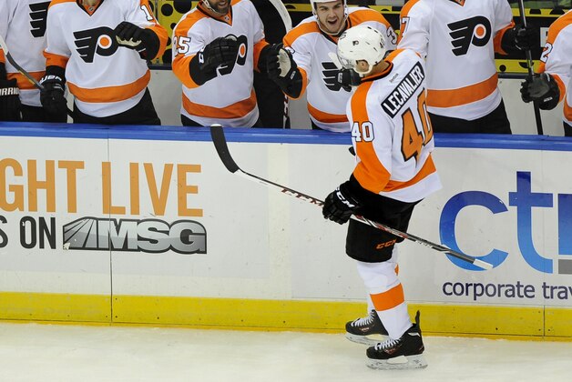 Philadelphia Flyers center Vincent Lecavalier (40) celebrates his goal against the New York Islanders with teammates in the first period of an NHL hockey game at the Nassau Coliseum on Saturday, Oct. 26, 2013, in Uniondale, N.Y. Lecavalier scored three goals during the Flyers 5-2 win. (AP Photo/Kathy Kmonicek)