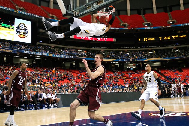 ATLANTA, GA - MARCH 13:  Jordan Clarkson #5 of the Missouri Tigers dunks against Alex Caruso #21 of the Texas A&M Aggies during the second round of the SEC Men's Basketball Tournament at Georgia Dome on March 13, 2014 in Atlanta, Georgia.  (Photo by Kevin C. Cox/Getty Images)