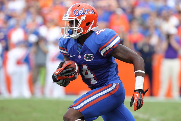 October 6, 2012; Gainesville FL, USA; Florida Gators wide receiver Andre Debose (4) runs with the ball during the second quarter against the LSU Tigers at Ben Hill Griffin Stadium. Mandatory Credit: Kim Klement-USA TODAY Sports