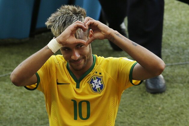 Brazil's Neymar forms a heart with his hands as he leaves the pitch after the World Cup round of 16 soccer match between Brazil and Chile at the Mineirao Stadium in Belo Horizonte, Brazil, Saturday, June 28, 2014. Brazil won 3-2 on penalties after the match ended 1-1 draw after extra-time. (AP Photo/Hassan Ammar) Brazil's Neymar forms a heart with his hands as he leaves the pitch after the World Cup round of 16 soccer match between Brazil and Chile at the Mineirao Stadium in Belo Horizonte, Brazil, Saturday, June 28, 2014. Brazil won 3-2 on penalties after the match ended 1-1 draw after extra-time. (AP Photo/Hassan Ammar)