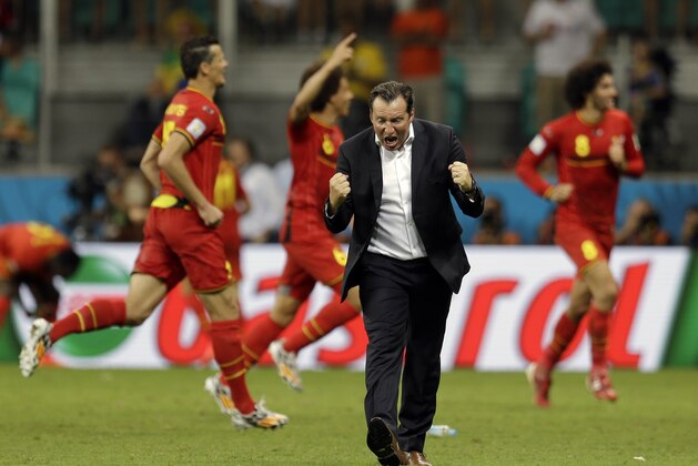 Belgium's head coach Marc Wilmots celebrates after Kevin De Bruyne scored his side's first goal in extra time during the World Cup round of 16 soccer match between Belgium and the USA at the Arena Fonte Nova in Salvador, Brazil, Tuesday, July 1, 2014. (AP Photo/Natacha Pisarenko)