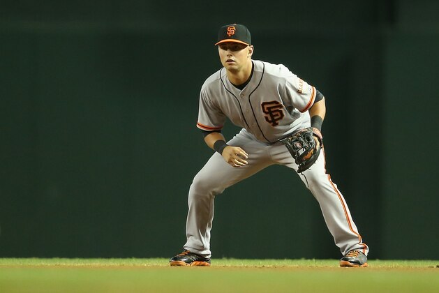 PHOENIX, AZ - JUNE 22:  Infielder Joe Panik #12 of the San Francisco Giants in action during the MLB game against the Arizona Diamondbacks at Chase Field on June 22, 2014 in Phoenix, Arizona. The Giants defeated the Diamondbacks 4-1.  (Photo by Christian Petersen/Getty Images)