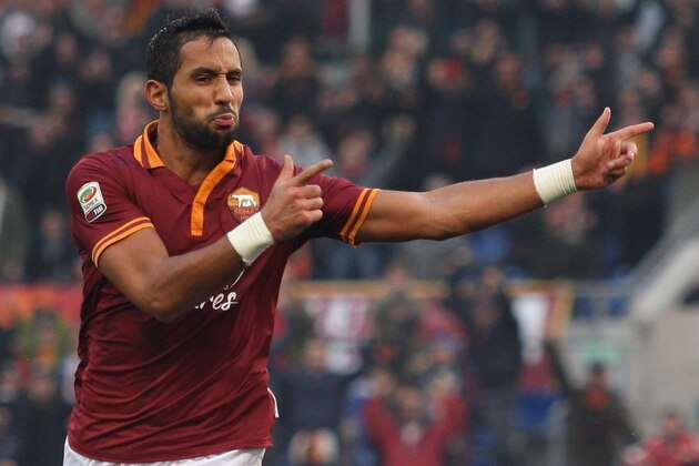 ROME, ITALY - DECEMBER 22:  Mehdi Benatia of AS Roma celebrates after scoring the third team's goal during the Serie A match between AS Roma and Calcio Catania at Stadio Olimpico on December 22, 2013 in Rome, Italy.  (Photo by Paolo Bruno/Getty Images)