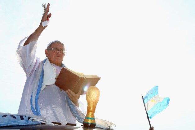 VESPASIANO, BRAZIL - JUNE 20:  A fan of Argentina dressed as the Pope before a training session for Argentina at Cidade do Galo on June 20, 2014 in Vespasiano, Brazil.  (Photo by Ronald Martinez/Getty Images)