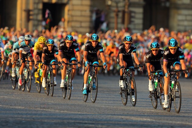 PARIS, FRANCE - JULY 21: Team SKY Procycling lead the bunch during the twenty first and final stage of the 2013 Tour de France, a processional 133.5KM road stage ending in an evening race around the Champs-Elysees, on July 21, 2013 in Paris, France.  (Photo by Bryn Lennon/Getty Images)