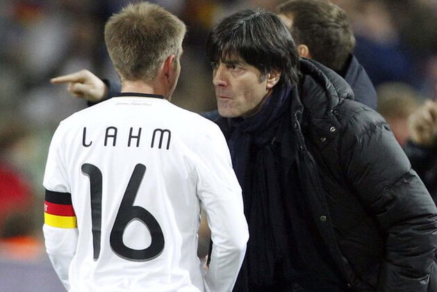 Germany's Philipp Lahm, left, argues with coach Jochaim Loew during a friendly soccer match between Germany and Italy in Dortmund, Germany, Wednesday, Feb. 9, 2011.   (AP Photo/Frank Augstein)