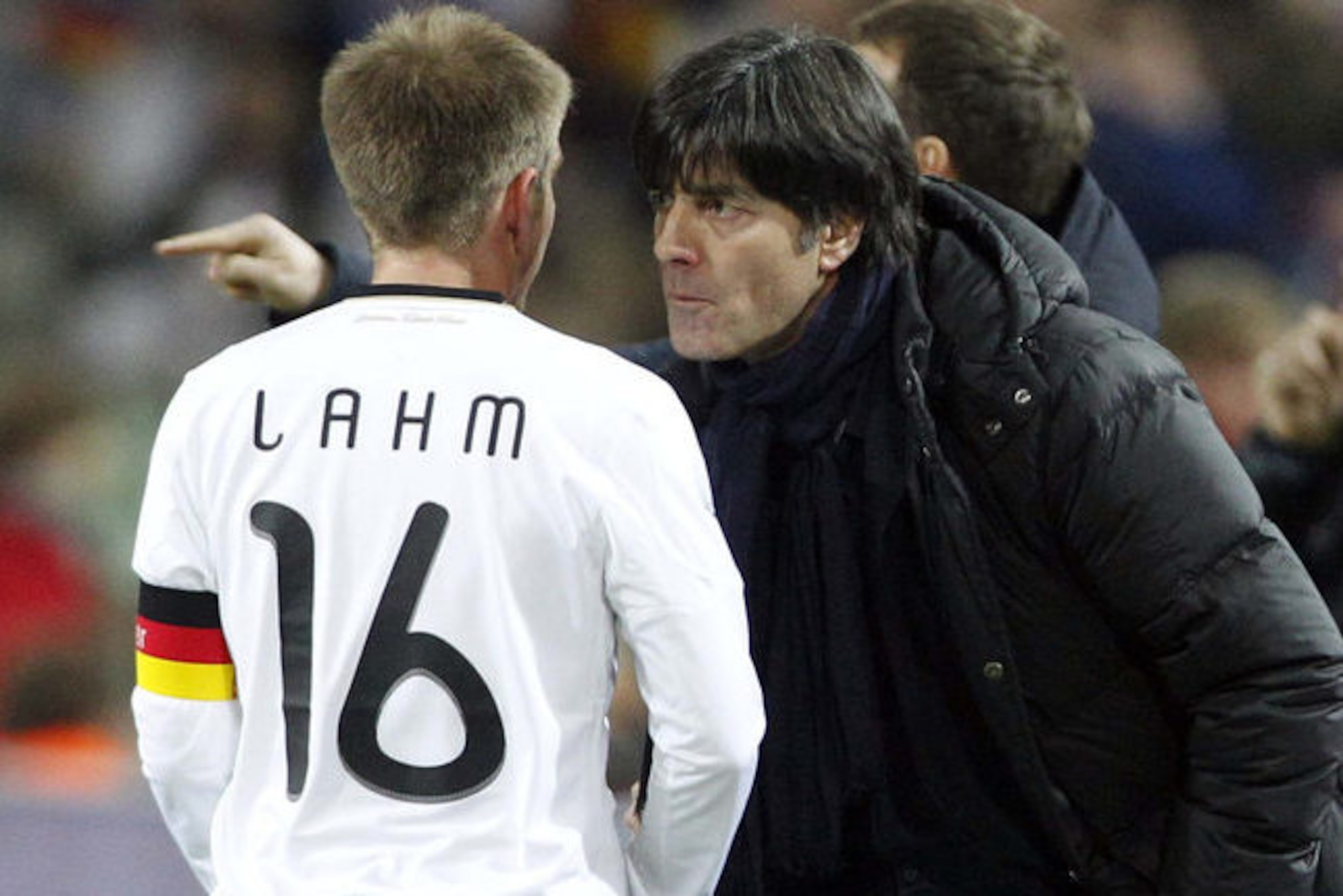 Germany's Philipp Lahm, left, argues with coach Jochaim Loew during a friendly soccer match between Germany and Italy in Dortmund, Germany, Wednesday, Feb. 9, 2011.   (AP Photo/Frank Augstein)