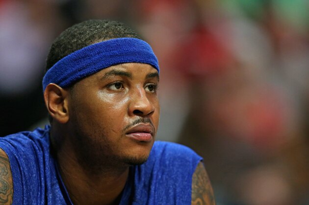 CHICAGO, IL - OCTOBER 31:  Carmelo Anthony #7 of the New York Knicks watches from the bench as his teammates take on the Chicago Bulls at the United Center on October 31, 2013 in Chicago, Illinois. The Bulls defeated the Knicks 82-81. NOTE TO USER: User expressly acknowledges and agrees that, by downloading and or using this photograph, User is consenting to the terms and conditions of the Getty Images License Agreement.  (Photo by Jonathan Daniel/Getty Images)