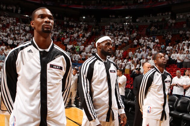 MIAMI, FL - MAY 14: Chris Bosh #1, LeBron James #6, and Dwyane Wade #3 of the Miami Heat stand during the National Anthem before Game Five of the Eastern Conference Semifinals against the Brooklyn Nets during the 2014 NBA playoffs at American Airlines Arena in Miami, Florida on May 14, 2014.  NOTE TO USER: User expressly acknowledges and agrees that, by downloading and or using this photograph, User is consenting to the terms and conditions of the Getty Images License Agreement. Mandatory Copyright Notice: Copyright 2014 NBAE  (Photo by Issac Baldizon/NBAE via Getty Images)