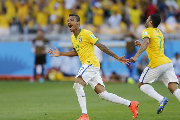 Brazil's Luiz Gustavo celebrates after the penalty shoot-out the World Cup round of 16 soccer match between Brazil and Chile at the Mineirao Stadium in Belo Horizonte, Brazil, Saturday, June 28, 2014. Brazil won 3-2 on penalties.(AP Photo/Frank Augstein)