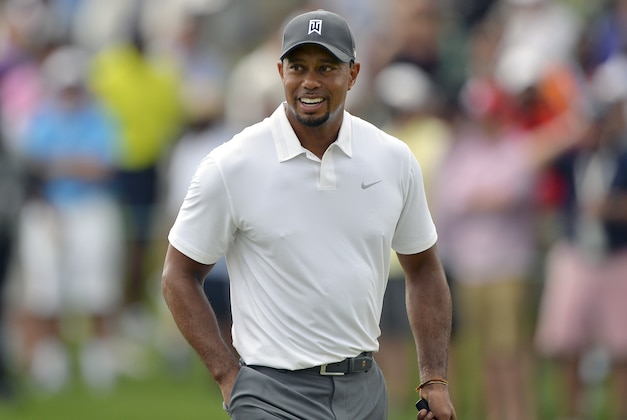Jun 27, 2014; Bethesda, MD, USA; Tiger Woods walks up to the green on the first hole during the second round of the Quicken Loans National golf tournament at Congressional Country Club - Blue Course. Mandatory Credit: Tommy Gilligan-USA TODAY Sports