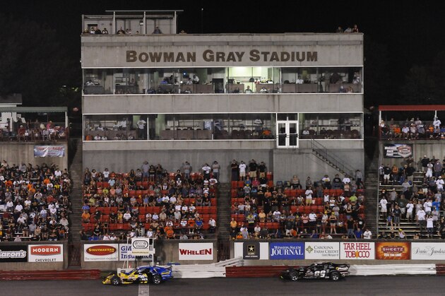 WINSTON-SALEM, NC - AUGUST 6:   L.W. Miller #36 leads over George Brunnhoelzl #09 during the NASCAR Whelen Southern Modified Tour Strutmasters.com 199 at the Bowman Gray Stadium on August 6, 2011 in Winston-Salem, North Carolina.  Miller won the race. (Photo by Sara D. Davis/Getty Images for NASCAR)