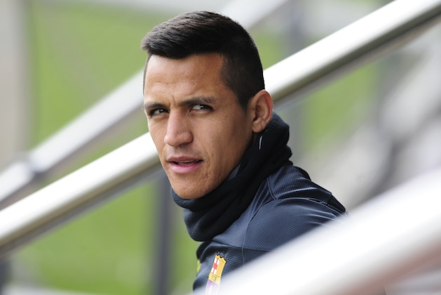 FC Barcelona's Alexis Sanchez, from Chile, looks on during a training session at the Sports Center FC Barcelona Joan Gamper in San Joan Despi, Spain, Monday, March 31, 2014. FC Barcelona will face Atletico Madrid in a first leg quarter-final Champions League soccer match on April 1. (AP Photo/Manu Fernandez)