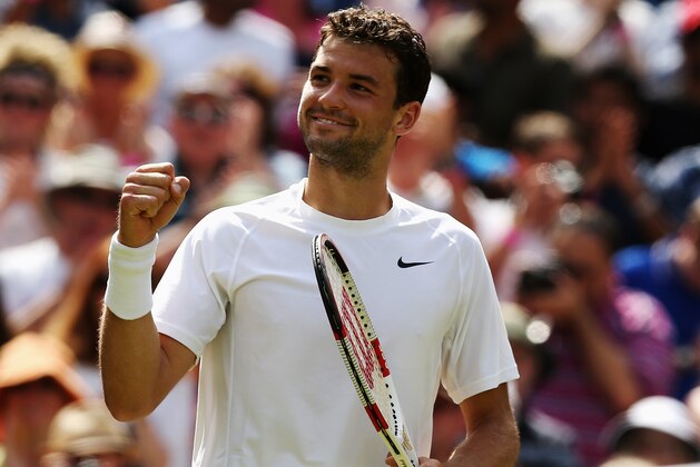 LONDON, ENGLAND - JULY 02:  Grigor Dimitrov of Bulgaria celebrates after winning his Gentlemen's Singles quarter-final match against Andy Murray of Great Britain on day nine of the Wimbledon Lawn Tennis Championships at the All England Lawn Tennis and Croquet Club  at Wimbledon on July 2, 2014 in London, England.  (Photo by Matthew Stockman/Getty Images)