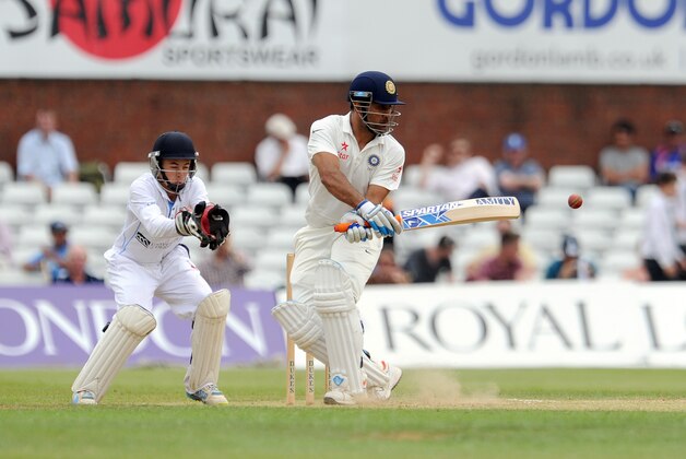 DERBY, ENGLAND - JULY 2:  M S Dhoni (R) of India in action during day two of the tour match between Derbyshire and India at The 3aaa County Ground on July 2, 2014 in Derby, England. (Photo by Clint Hughes/Getty Images)