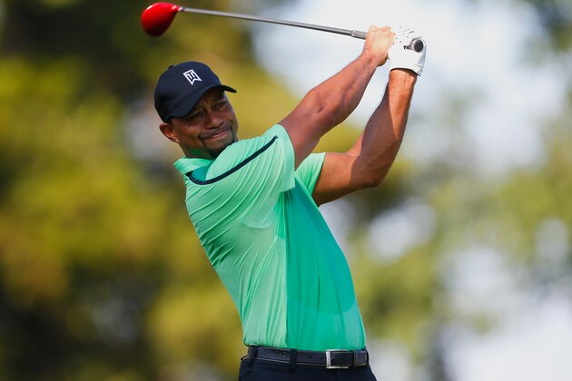 BETHESDA, MD - JUNE 26:  Tiger Woods of the United States watches his tee shot on the 12th hole during a first round of the Quicken Loans National at Congressional Country Club on June 26, 2014 in Bethesda, Maryland.  (Photo by Jeff Haynes/Getty Images)