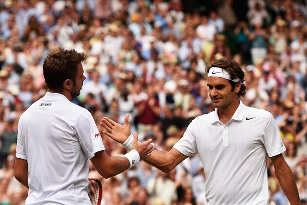 LONDON, ENGLAND - JULY 02:  Roger Federer of Switzerland shakes hands with Stan Wawrinka of Switzerland after their Gentlemen's Singles quarter-final match on day nine of the Wimbledon Lawn Tennis Championships at the All England Lawn Tennis and Croquet Club  at Wimbledon on July 2, 2014 in London, England.  (Photo by Pool/Getty Images)