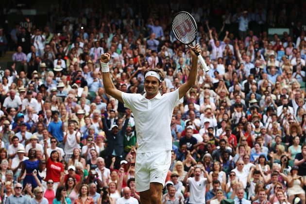 LONDON, ENGLAND - JULY 02:  Roger Federer of Switzerland celebrates after winning his Gentlemen's Singles quarter-final match against Stan Wawrinka of Switzerland on day nine of the Wimbledon Lawn Tennis Championships at the All England Lawn Tennis and Croquet Club  at Wimbledon on July 2, 2014 in London, England.  (Photo by Jan Kruger/Getty Images)