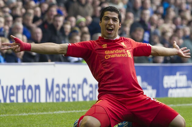 Liverpool's Luis Suarez celebrates after scoring against Everton, during their English Premier League soccer match at Goodison Park Stadium, Liverpool, England, Saturday Nov. 23, 2013. (AP Photo/Jon Super)