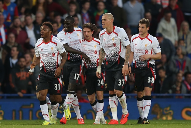Liverpool's Joe Allen, center, celebrates after scoring the opening goal during their English Premier League soccer match between Crystal Palace and Liverpool at Selhurst Park stadium in London, Monday, May 5, 2014. (AP Photo/Alastair Grant)