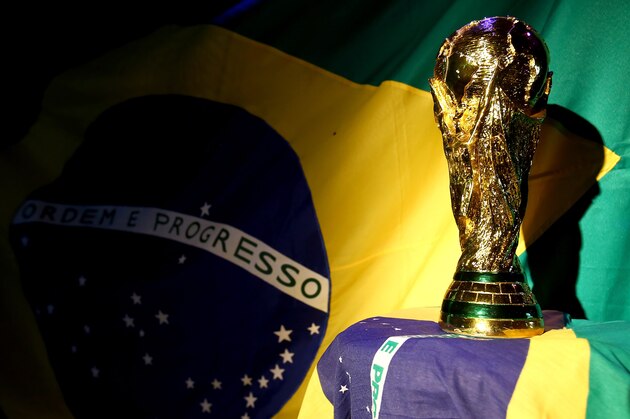 PORTO SEGURO, BRAZIL - JUNE 12:  A replica of the FIFA world cup trophy is displayed during the Group A match between Brazil and Croatia on June 12, 2014 in Porto Seguro, Brazil.  (Photo by Martin Rose/Getty Images)