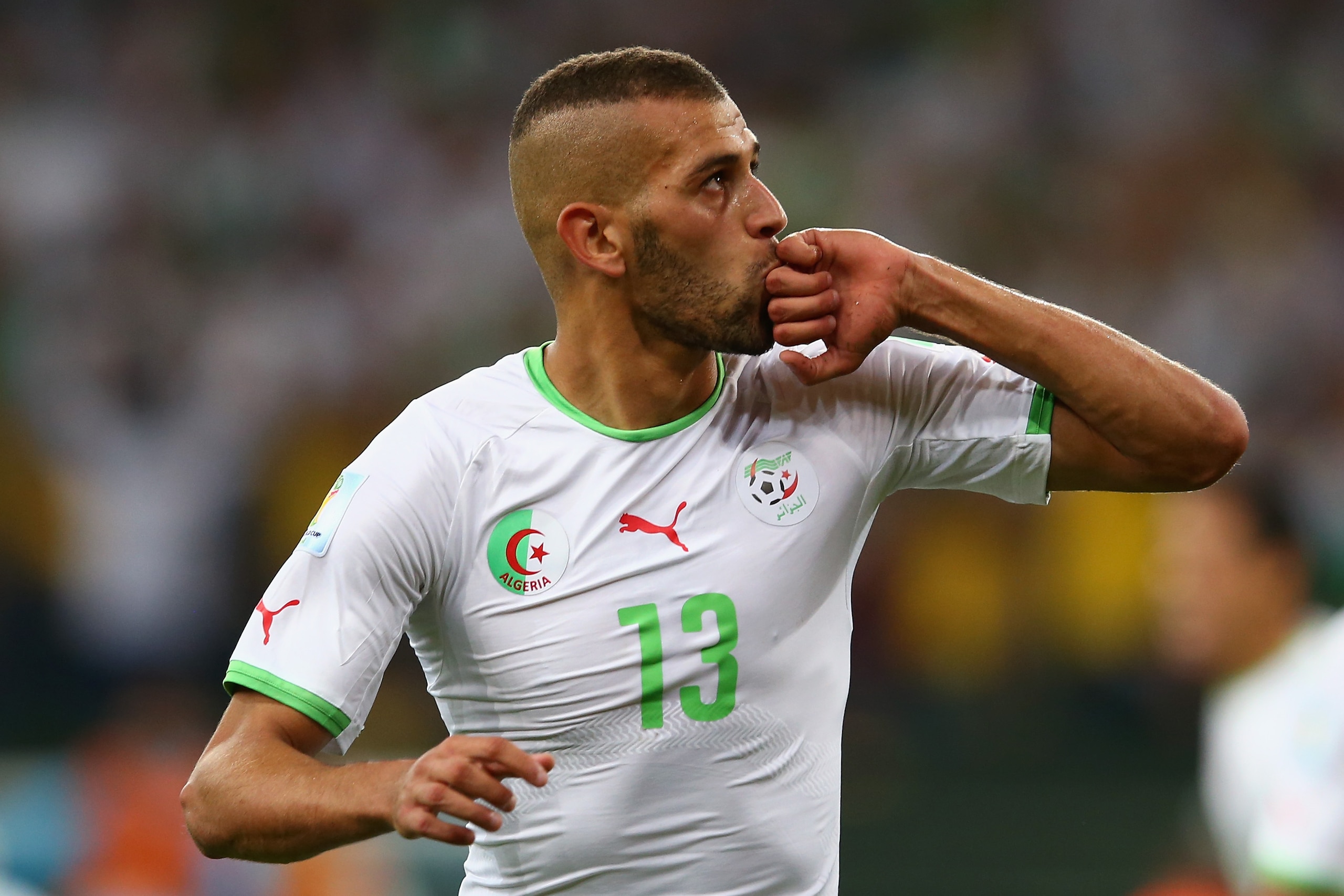 CURITIBA, BRAZIL - JUNE 26: Islam Slimani of Algeria celebrates scoring his team's first goal during the 2014 FIFA World Cup Brazil Group H match between Algeria and Russia at Arena da Baixada on June 26, 2014 in Curitiba, Brazil.  (Photo by Julian Finney/Getty Images)
