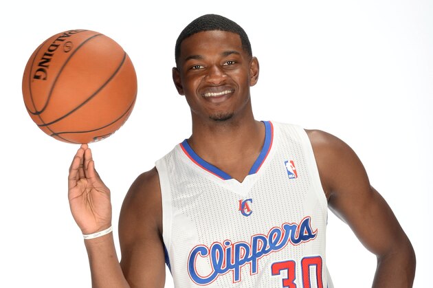 LOS ANGELES, CA - JUNE 30:  CJ Wilcox #30 of the Los Angeles Clippers posses for a portrait after his welcome press conference on June 30, 2014 in Los Angeles, California.  NOTE TO USER: User expressly acknowledges and agrees that, by downloading and/or using this Photograph, user is consenting to the terms and conditions of the Getty Images License Agreement. Mandatory Copyright Notice: Copyright 2012 NBAE  (Photo by Noah Graham/NBAE via Getty Images)