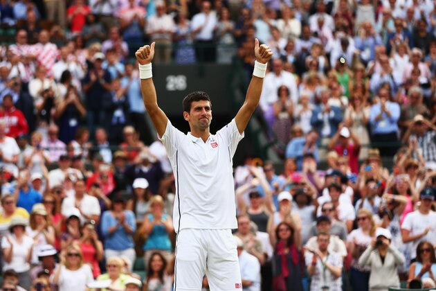 LONDON, ENGLAND - JULY 02:  Novak Djokovic of Serbia celebrates after winning his Gentlemen's Singles quarter-final match against Marin Cilic of Croatia on day nine of the Wimbledon Lawn Tennis Championships at the All England Lawn Tennis and Croquet Club  at Wimbledon on July 2, 2014 in London, England.  (Photo by Al Bello/Getty Images)