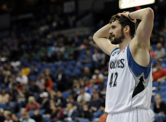 Minnesota Timberwolves forward Kevin Love (42) reacts in an NBA basketball game against the San Antonio Spurs at the Target Center on in Minneapolis on Tuesday, April 8, 2014. (AP Photo/Hannah Foslien)