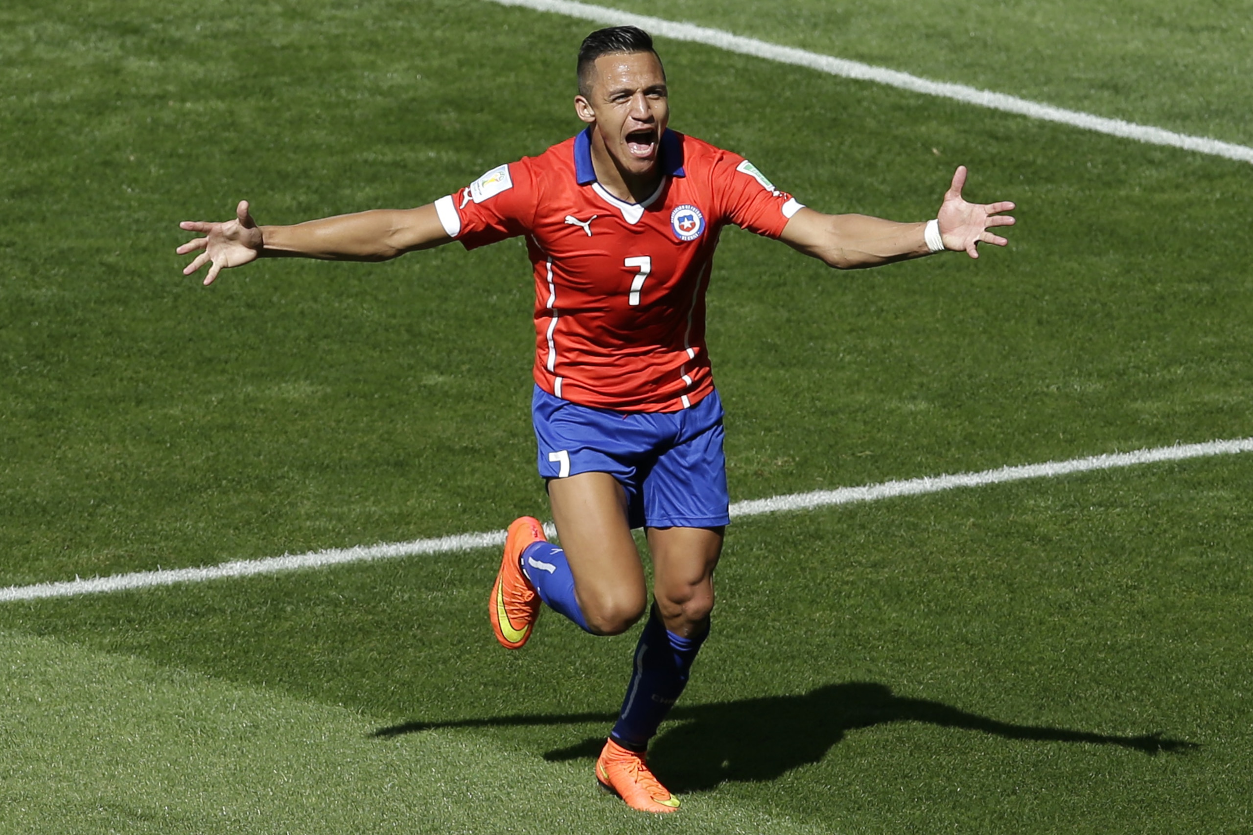 Chile's Alexis Sanchez celebrates scoring his side's first goal during the World Cup round of 16 soccer match between Brazil and Chile at the Mineirao Stadium in Belo Horizonte, Brazil, Saturday, June 28, 2014. (AP Photo/Hassan Ammar)