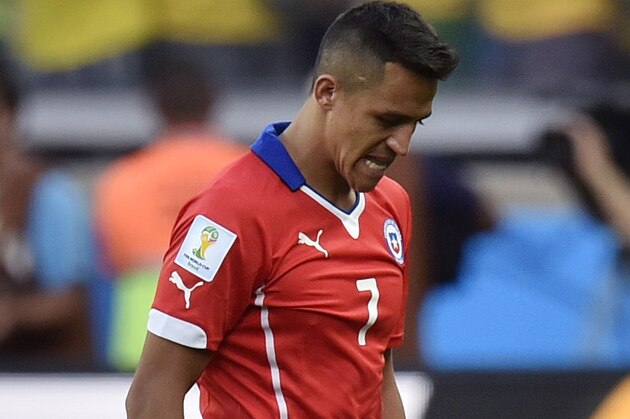 Chile's Alexis Sanchez leaves the field after a penalty  shoot out at the end of the World Cup round of 16 soccer match between Brazil and Chile at the Mineirao Stadium in Belo Horizonte, Brazil, Saturday, June 28, 2014. Brazil won the match 3-2 on penalties after the match ended 1-1. (AP Photo/Martin Meissner)