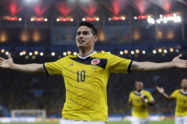 FILE - In this June 28, 2014, file photo, Colombia's James Rodriguez celebrates after scoring the opening goal during the World Cup round of 16 soccer match between Colombia and Uruguay at the Maracana Stadium in Rio de Janeiro, Brazil. Never before has the star-crossed nation made the quarterfinals. There is even waxing poetic about World Cup unity accelerating the pace of 18-month-old peace talks to end a half-century of conflict that has claimed some 220,000 lives. (AP Photo/Natacha Pisarenko)