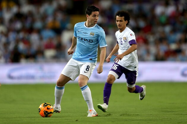 AL AIN, UNITED ARAB EMIRATES - MAY 15: Samir Nasri of Manchester City in action during the friendly match between Al Ain and Manchester City at Hazza bin Zayed Stadium on May 15, 2014 in Al Ain, United Arab Emirates. (Photo by Warren Little/Getty Images) AL AIN, UNITED ARAB EMIRATES - MAY 15: Samir Nasri of Manchester City in action during the friendly match between Al Ain and Manchester City at Hazza bin Zayed Stadium on May 15, 2014 in Al Ain, United Arab Emirates. (Photo by Warren Little/Getty Images)