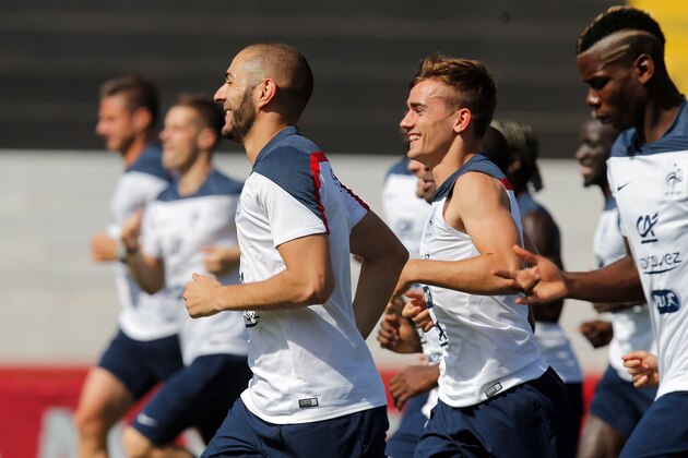 France's Karim Benzema, left front, smiles with Antoine Griezmann, center right, while running during a training session at the Santa Cruz stadium, in Ribeirao Preto, Brazil, Wednesday, July 2, 2014. France will face Germany in their World Cup quarterfinal, next Friday. (AP Photo/David Vincent) France's Karim Benzema, left front, smiles with Antoine Griezmann, center right, while running during a training session at the Santa Cruz stadium, in Ribeirao Preto, Brazil, Wednesday, July 2, 2014. France will face Germany in their World Cup quarterfinal, next Friday. (AP Photo/David Vincent)