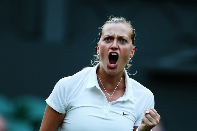 LONDON, ENGLAND - JULY 01:  Petra Kvitova of Czech Republic celebrates winning her Ladies' Singles quarter-final match against Barbora Zahlavova Strycova of Czech Republic on day eight of the Wimbledon Lawn Tennis Championships at the All England Lawn Tennis and Croquet Club on July 1, 2014 in London, England.  (Photo by Jan Kruger/Getty Images)