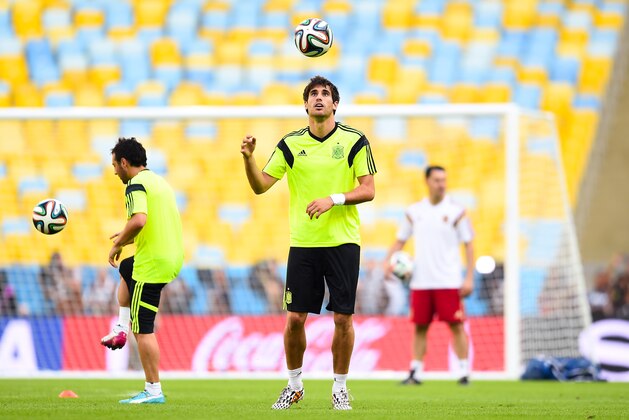 RIO DE JANEIRO, BRAZIL - JUNE 17:  Javi Martinez of Spain heads the ball during a Spain training session ahead of their 2014 FIFA World Cup Group B match against Chile at Maracana on June 17, 2014 in Rio de Janeiro, Brazil.  (Photo by David Ramos/Getty Images)