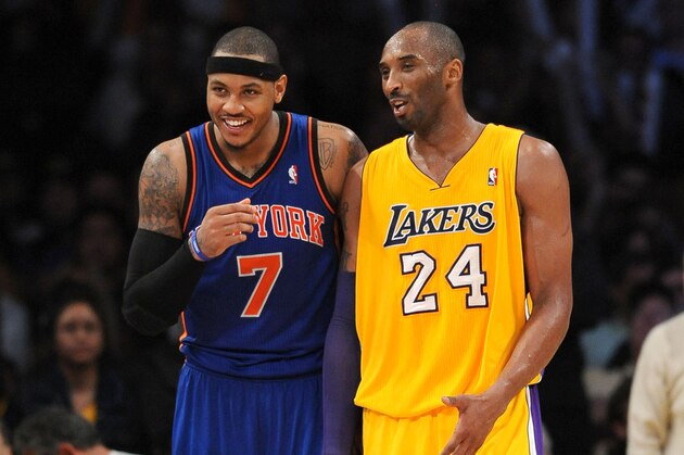 LOS ANGELES, CA - DECEMBER 29:  Carmelo Anthony #7 of the New York Knicks and Kobe Bryant #24 of the Los Angeles Lakers look on during their game at Staples Center on December 29, 2011 in Los Angeles, California. NOTE TO USER: User expressly acknowledges and agrees that, by downloading and/or using this Photograph, user is consenting to the terms and conditions of the Getty Images License Agreement. Mandatory Copyright Notice: Copyright 2011 NBAE (Photo by Juan Ocampo/NBAE via Getty Images)