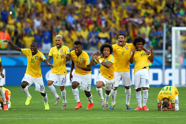 BELO HORIZONTE, BRAZIL - JUNE 28: (L-R) Thiago Silva, Luiz Gustavo, Ramires, Dani Alves, Jo, Marcelo, Hulk, Willian and Neymar of Brazil celebrate after defeating Chile in a penalty shootout during the 2014 FIFA World Cup Brazil round of 16 match between Brazil and Chile at Estadio Mineirao on June 28, 2014 in Belo Horizonte, Brazil.  (Photo by Quinn Rooney/Getty Images)