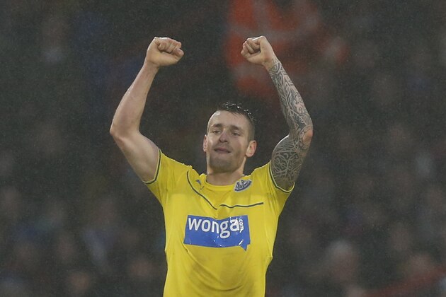 Newcastle United's Mathieu Debuchy celebrates Crystal Palace's Daniel Gabbidon own goal during their English Premier League soccer match at Selhurst Park, London, Saturday, Dec. 21, 2013. (AP Photo/Sang Tan)