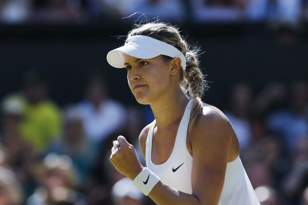 Eugenie Bouchard of Canada celebrates after winning the first set as she plays against Simona Halep of Romania during their women’s singles semifinal match at the All England Lawn Tennis Championships in Wimbledon, London, Thursday, July 3, 2014. (AP Photo/Ben Curtis) Eugenie Bouchard of Canada celebrates after winning the first set as she plays against Simona Halep of Romania during their women’s singles semifinal match at the All England Lawn Tennis Championships in Wimbledon, London, Thursday, July 3, 2014. (AP Photo/Ben Curtis)
