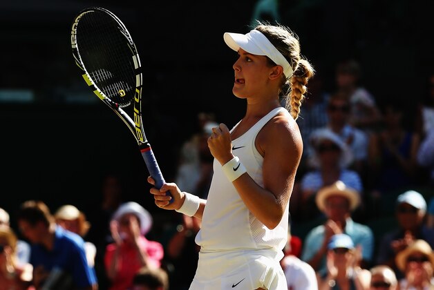 LONDON, ENGLAND - JULY 03:  Eugenie Bouchard of Canada celebrates match point and winning her Ladies' Singles semi-final match against Simona Halep of Romania on day ten of the Wimbledon Lawn Tennis Championships at the All England Lawn Tennis and Croquet Club  on July 3, 2014 in London, England.  (Photo by Matthew Stockman/Getty Images)