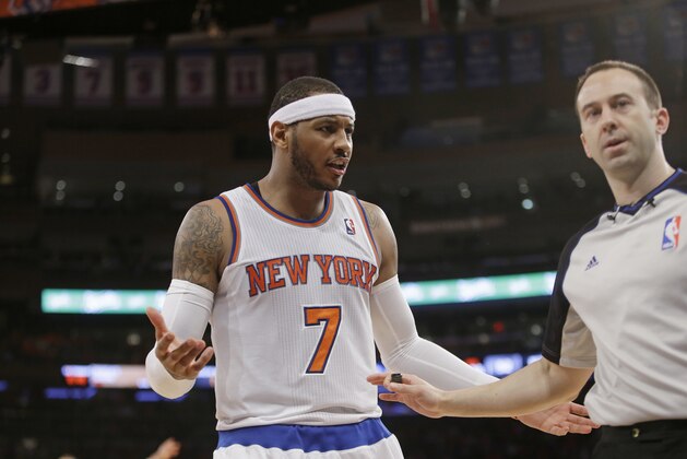 New York Knicks' Carmelo Anthony (7) argues a call during the second half of an NBA basketball game against the Brooklyn Nets Wednesday, April 2, 2014, in New York. The Knicks won the game 110-81. (AP Photo/Frank Franklin II)