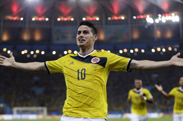 FILE - In this June 28, 2014, file photo, Colombia's James Rodriguez celebrates after scoring the opening goal during the World Cup round of 16 soccer match between Colombia and Uruguay at the Maracana Stadium in Rio de Janeiro, Brazil. Never before has the star-crossed nation made the quarterfinals. There is even waxing poetic about World Cup unity accelerating the pace of 18-month-old peace talks to end a half-century of conflict that has claimed some 220,000 lives. (AP Photo/Natacha Pisarenko)