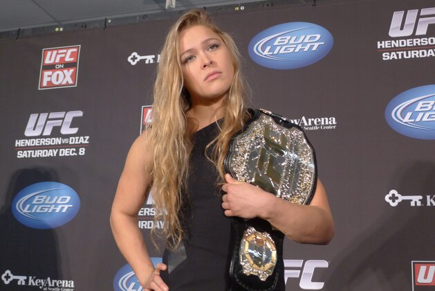 (Rowdy) Ronda Rousey shows off her UFC bantamweight championship belt, on Thursday Dec. 6, 2012. UFC president Dana White handed out the belt Thursday, saying the former Strikeforce title-holder will make her UFC debut on Feb., 23 against Liz Carmouche.  (AP Photo/The  Canadian Press, Neil Davidson)