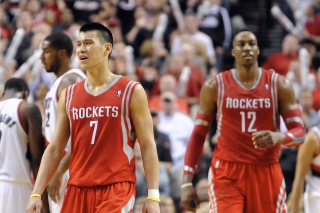 Houston Rockets' Jeremy Lin (7) and Dwight Howard (12) react to a foul call against the Portland Trail Blazers during the final minutes of game six of an NBA basketball first-round playoff series game in Portland, Ore., Friday May 2, 2014. The Trail Blazers won the series in a 99-98 win. (AP Photo/Greg Wahl-Stephens)