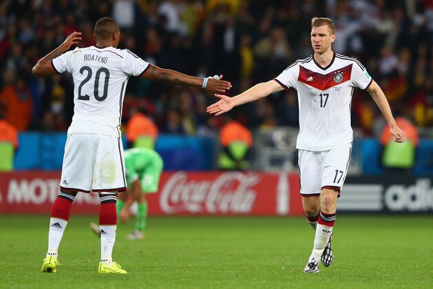 PORTO ALEGRE, BRAZIL - JUNE 30:  Jerome Boateng and Per Mertesacker of Germany celebrate their team's second goal in extra time during the 2014 FIFA World Cup Brazil Round of 16 match between Germany and Algeria at Estadio Beira-Rio on June 30, 2014 in Porto Alegre, Brazil.  (Photo by Jamie Squire/Getty Images)
