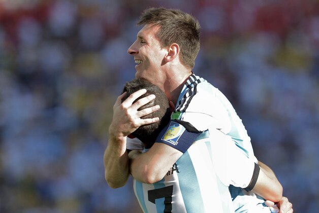 Argentina's Lionel Messi celebrates with Angel di Maria after di Maria scored his side's only and winning goal in extra time during the World Cup round of 16 soccer match between Argentina and Switzerland at the Itaquerao Stadium in Sao Paulo, Brazil, Tuesday, July 1, 2014. Argentina defeated Switzerland 1-0 to move on to the quarterfinals. (AP Photo/Manu Fernandez) Argentina's Lionel Messi celebrates with Angel di Maria after di Maria scored his side's only and winning goal in extra time during the World Cup round of 16 soccer match between Argentina and Switzerland at the Itaquerao Stadium in Sao Paulo, Brazil, Tuesday, July 1, 2014. Argentina defeated Switzerland 1-0 to move on to the quarterfinals. (AP Photo/Manu Fernandez)